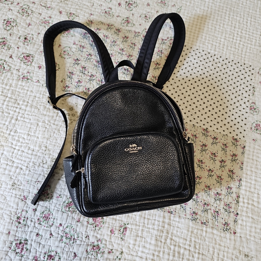 Coach mini court backpack in black.
